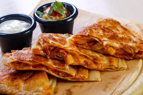 cannabis infused quesadillas with guacamole and sour cream