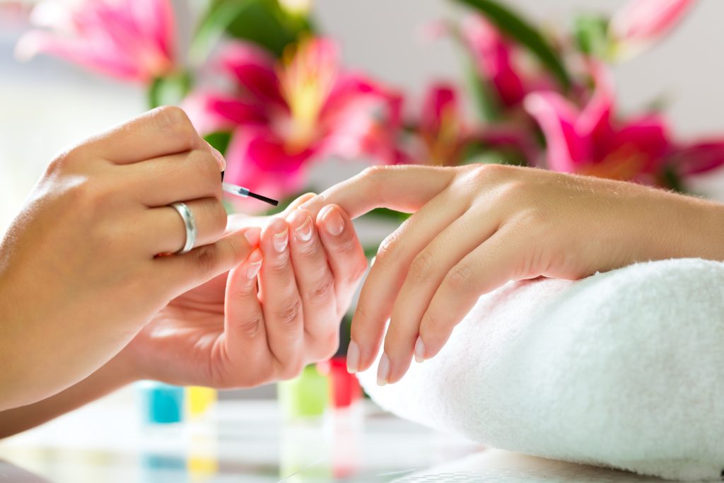 girl performing cannabis manicure