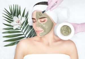 applying cbd mask to face for cbd facial